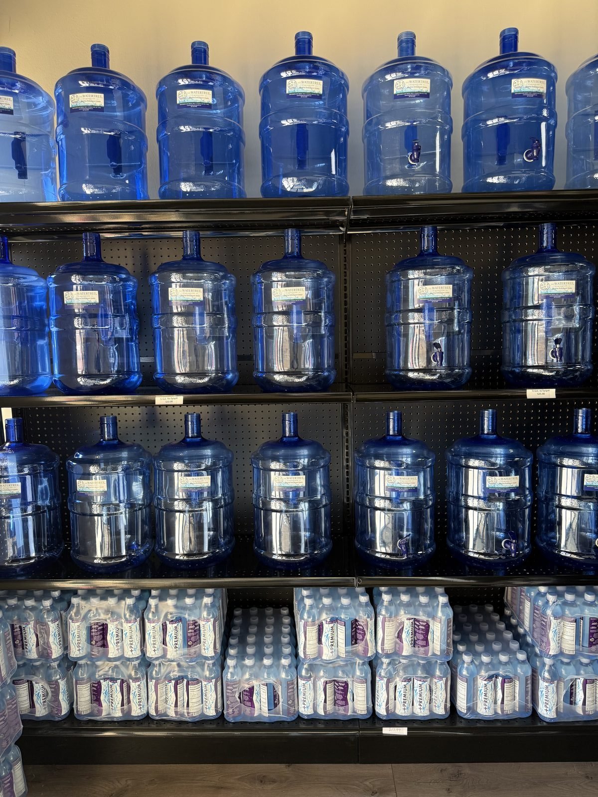 Wall of Water Tree League City 5-gallon jugs and bottled water in-store